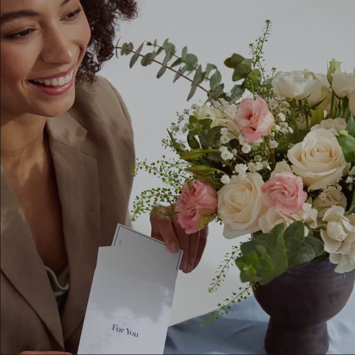 Lady with a flowers in a vase